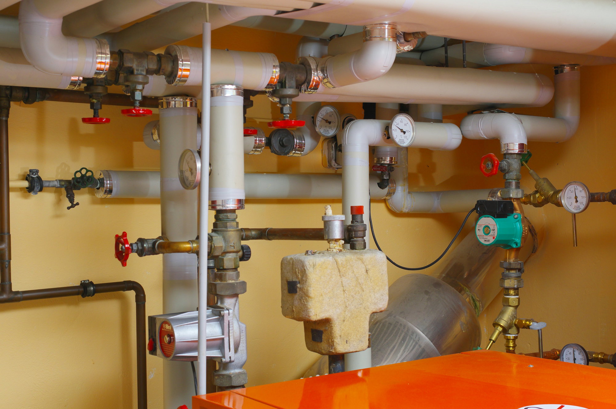 pipes-and-valves-in-a-room-with-orange-table.jpg pipes and valves in a room with orange table